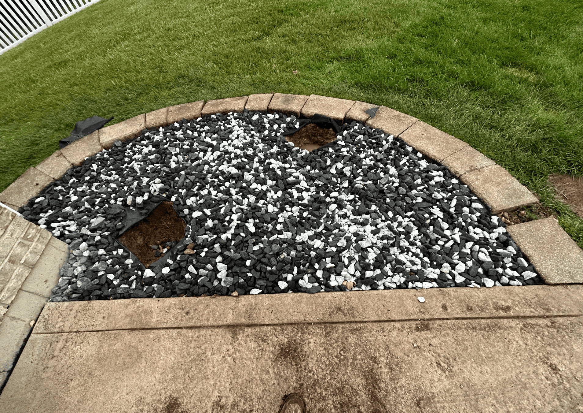 Half circle rock feature accenting a front yard tree