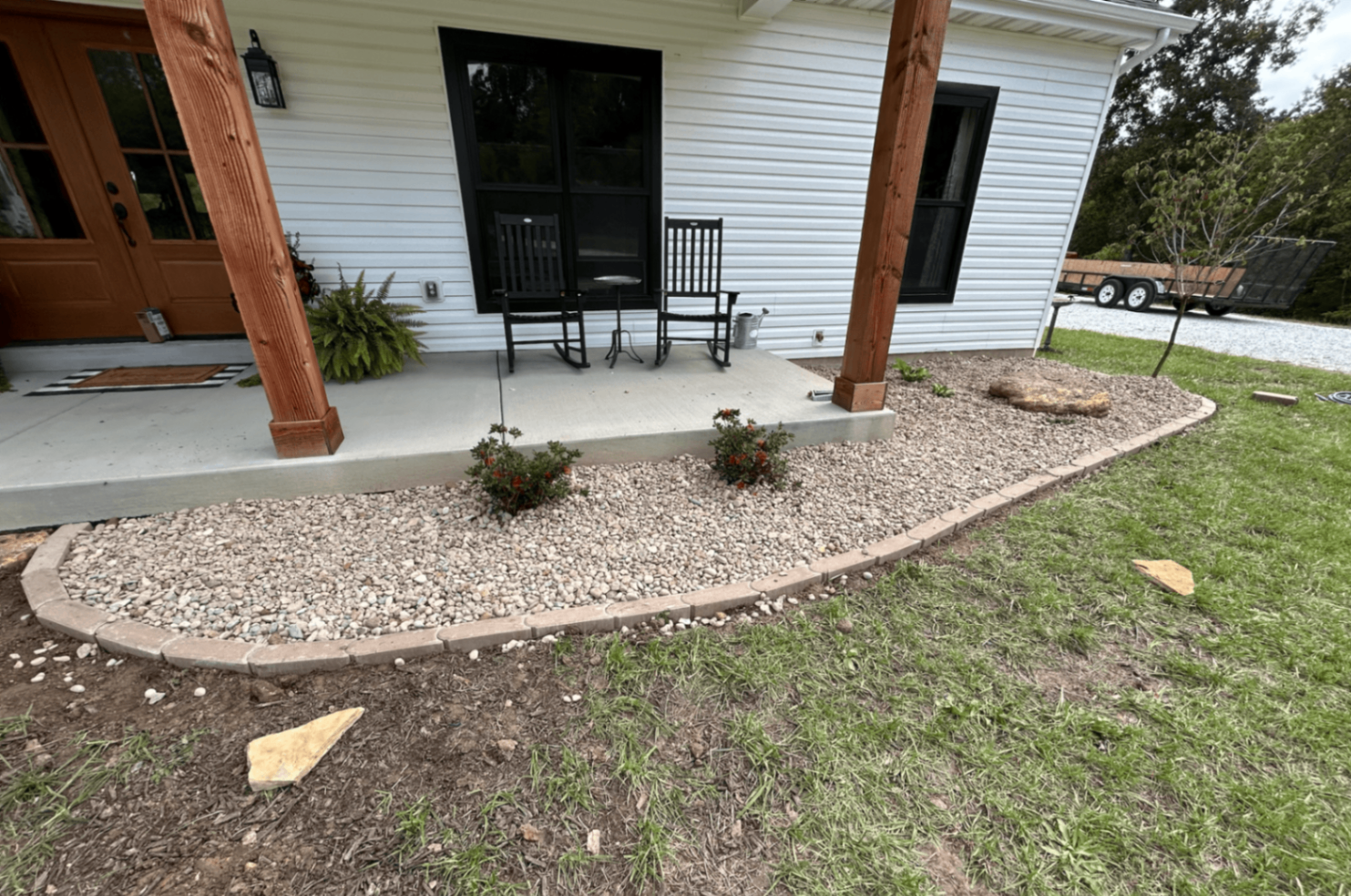 Oakridge rock bed installation with clean landscape edging